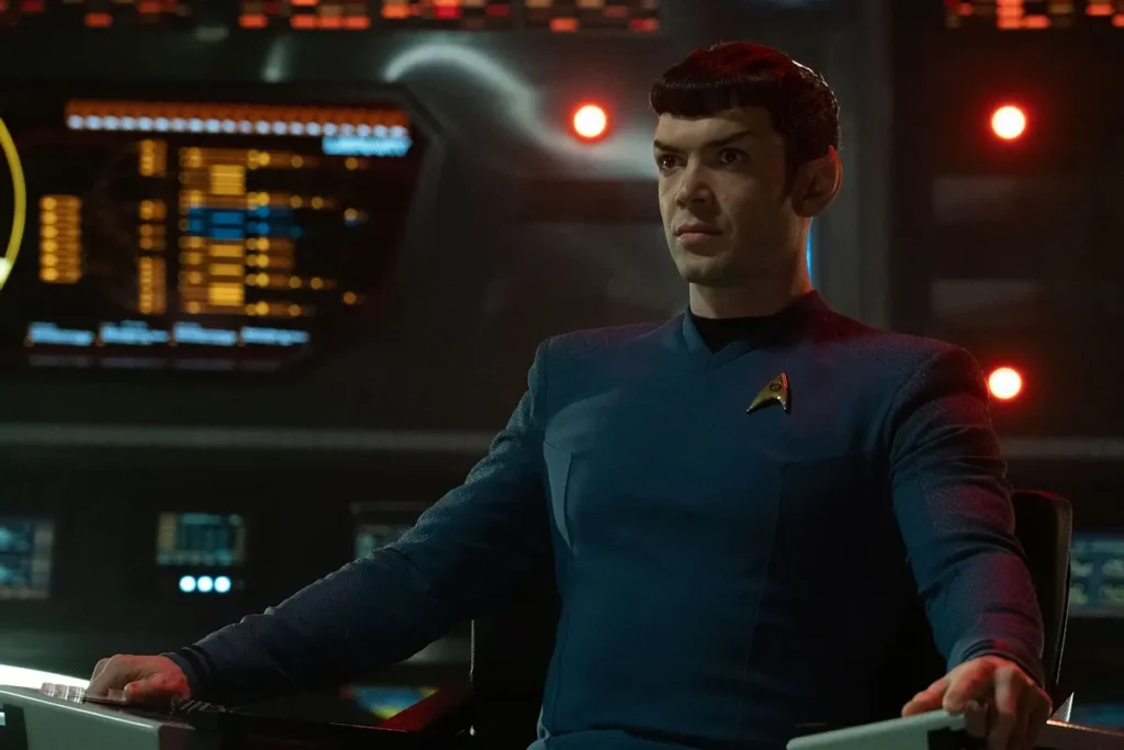 Ethan Peck on Strange New Worlds: I Had the Same “Quite Challenging” Problem That Leonard Nimoy Faced as Spock in Star Trek 1 Spock sits at the command center of the bridge