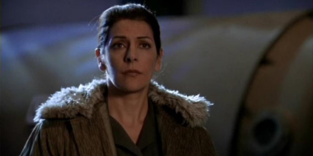 Star Trek: No One Remembers the Stargate SG-1 Character Marina Sirtis Played 6 Years After TNG Ended 1 Marina Sirtis standing still in a still from Stargate SG-1