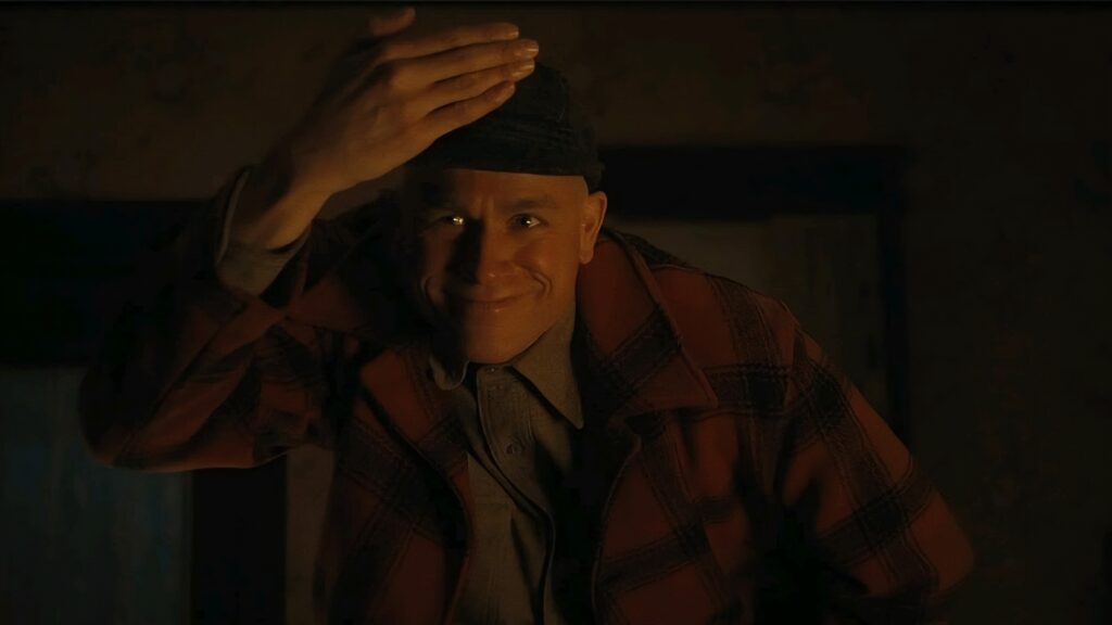 Monster: The Ed Gein Story Review — Ryan Murphy and Charlie Hunnam Mistake Provocation for Substance 18 A man holds his hat