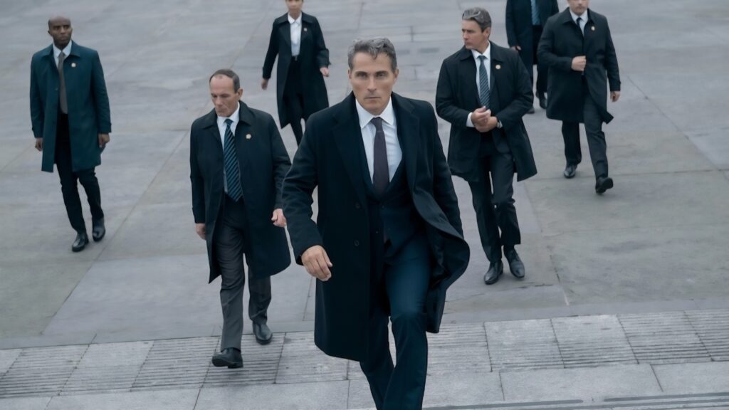 The Diplomat Season 3 Review — Keri Russell is Magnetic in a Series that is Pure, Pulpy, Plot-driven Addiction 29 A man walks up some stairs