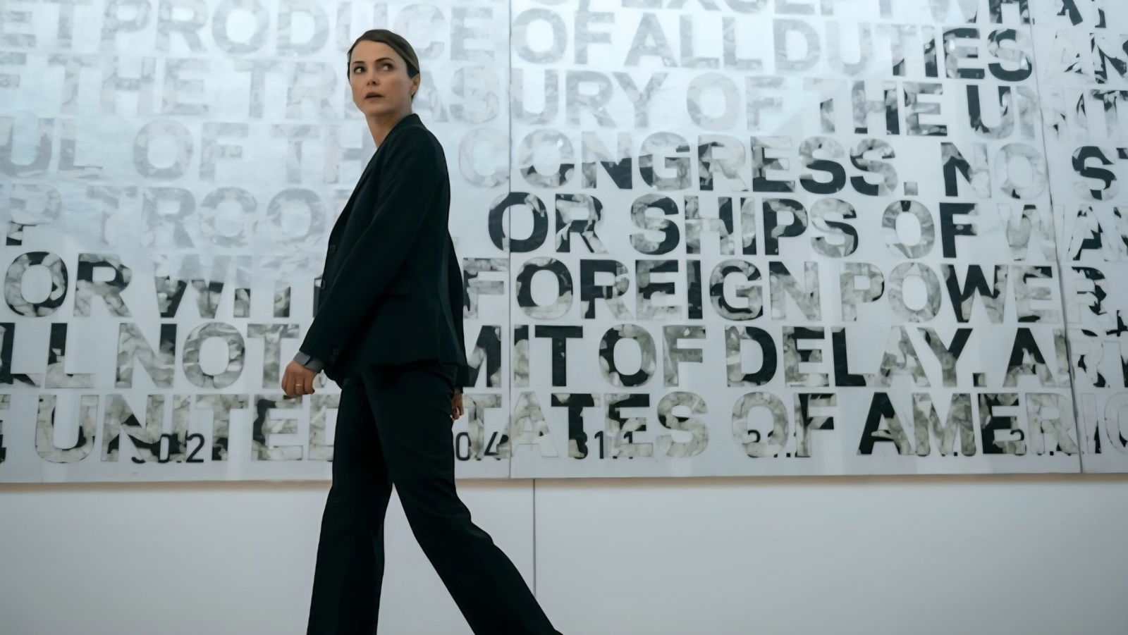 The Diplomat Season 3 Review — Keri Russell is Magnetic in a Series that is Pure, Pulpy, Plot-driven Addiction 36 The diplomat walks through an office