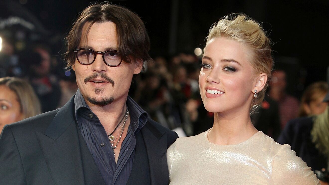Amber Heard and Johnny Depp pose for a photo before their gnarly run.