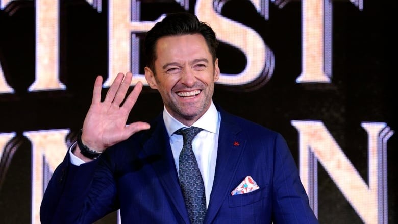 Hugh Jackman waves at fans during the Japan premiere for The Greatest Showman. 