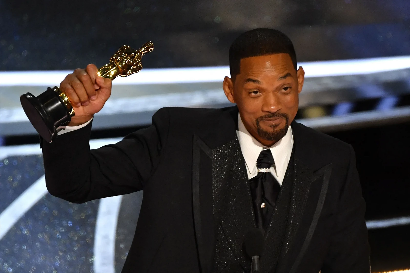Will Smith accepting an Oscar shortly after slapping Chris Rock.