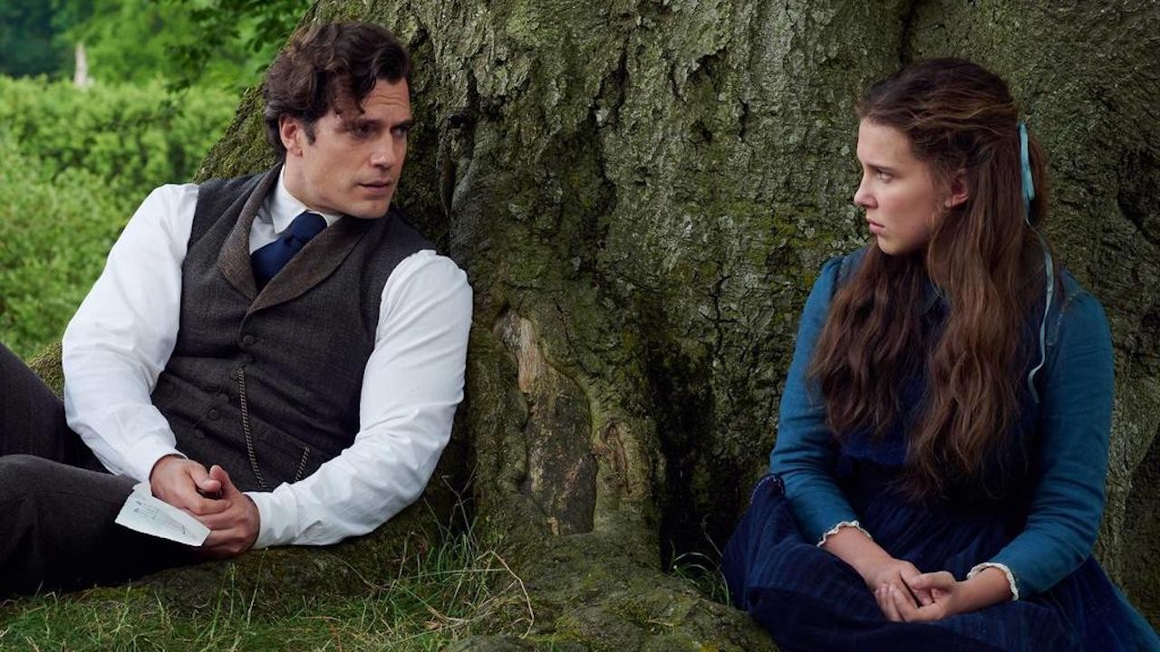 Henry Cavill as Sherlock Holmes along with Millie Bobby Brown in Enola Holmes (2020).