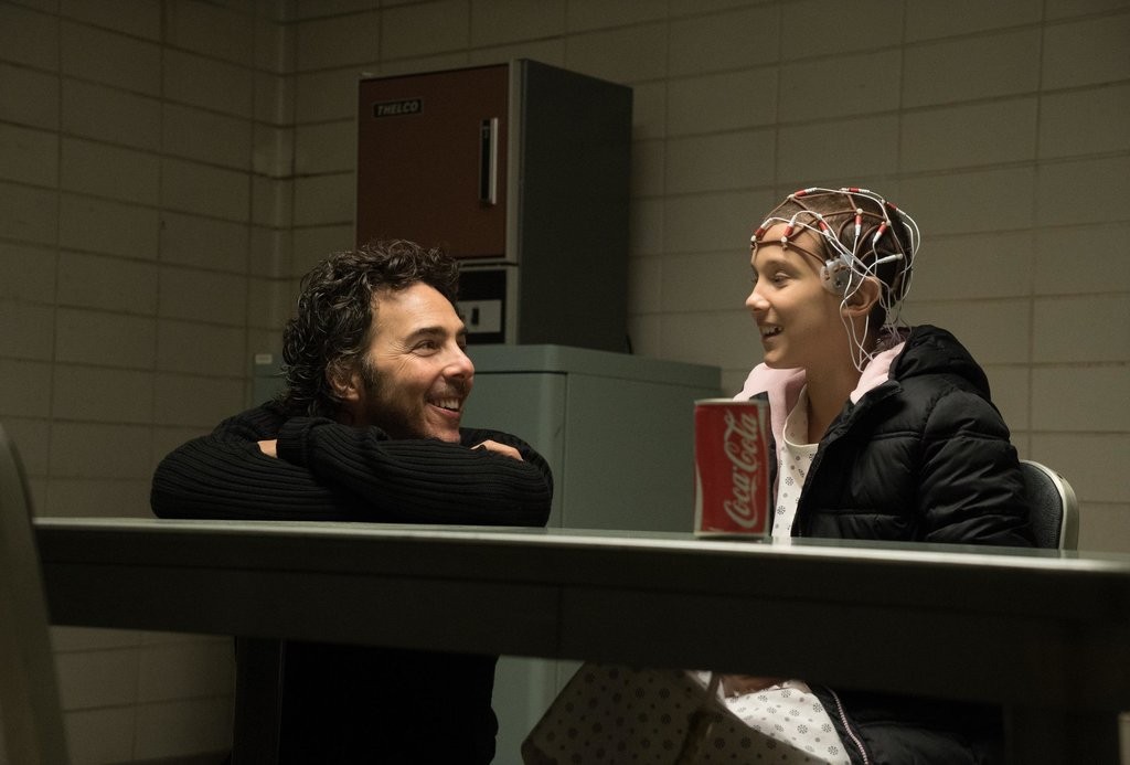 Shawn Levy with Millie Bobby Brown on Stranger Things Season 1 set