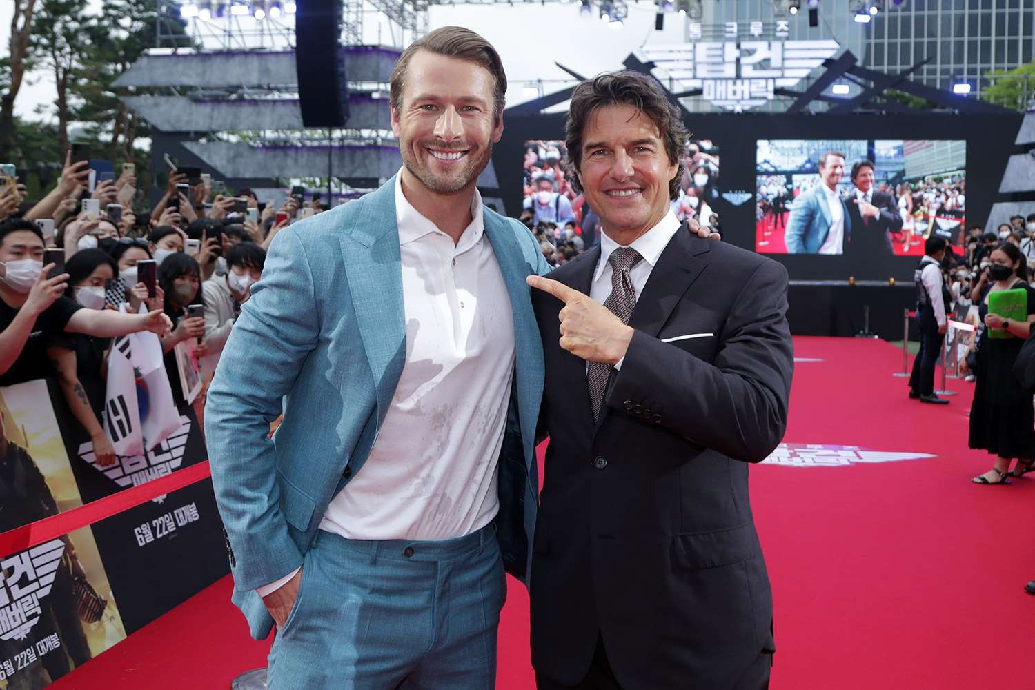 Glen Powell with Tom Cruise at the Korean premiere of Top Gun: Maverick