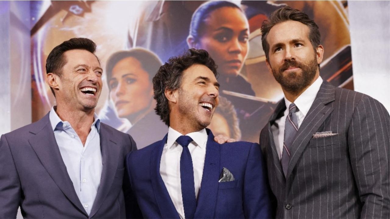 Shawn Levy (center) with Hugh Jackman and Ryan Reynolds