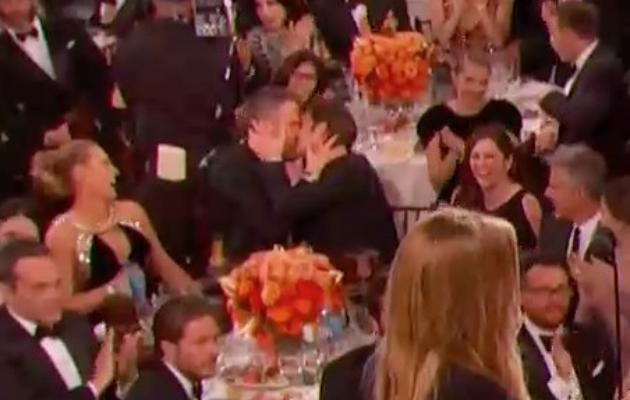 In a rather blurred image, Ryan Reynolds and Andrew Garfield shared a kiss.