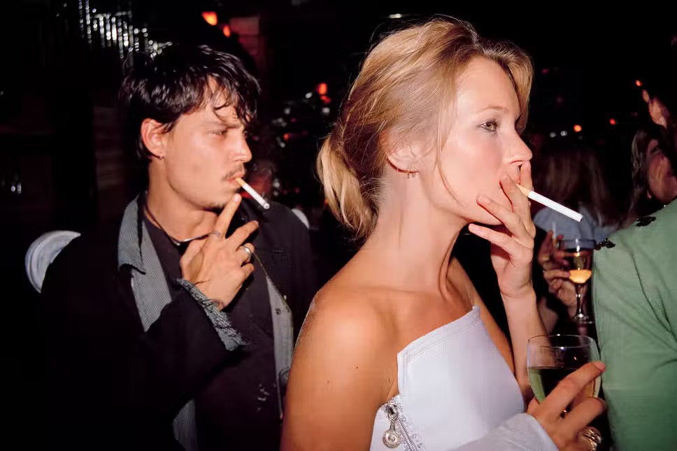 Johnny Depp and Kate Moss at a party
