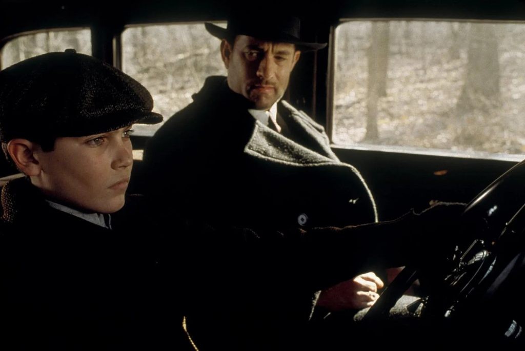 Tom Hanks and Tyler Hoechlin in a car in a scene from Road to Perdition
