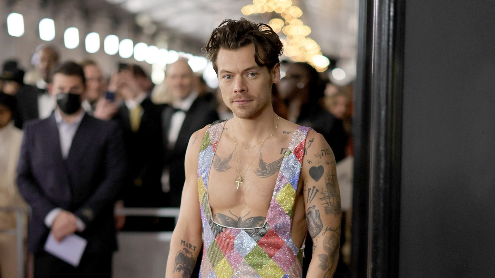 Harry Styles in a rainbow jumpsuit 