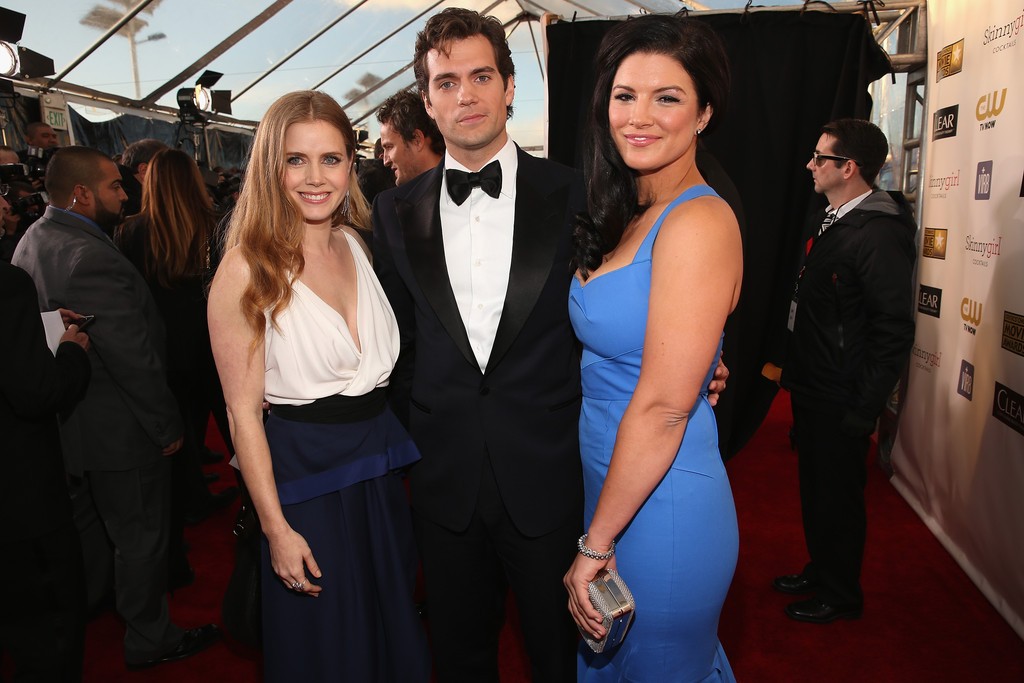 Henry Cavill and Gina Carano pose with Man of Steel co-star Amy Adams