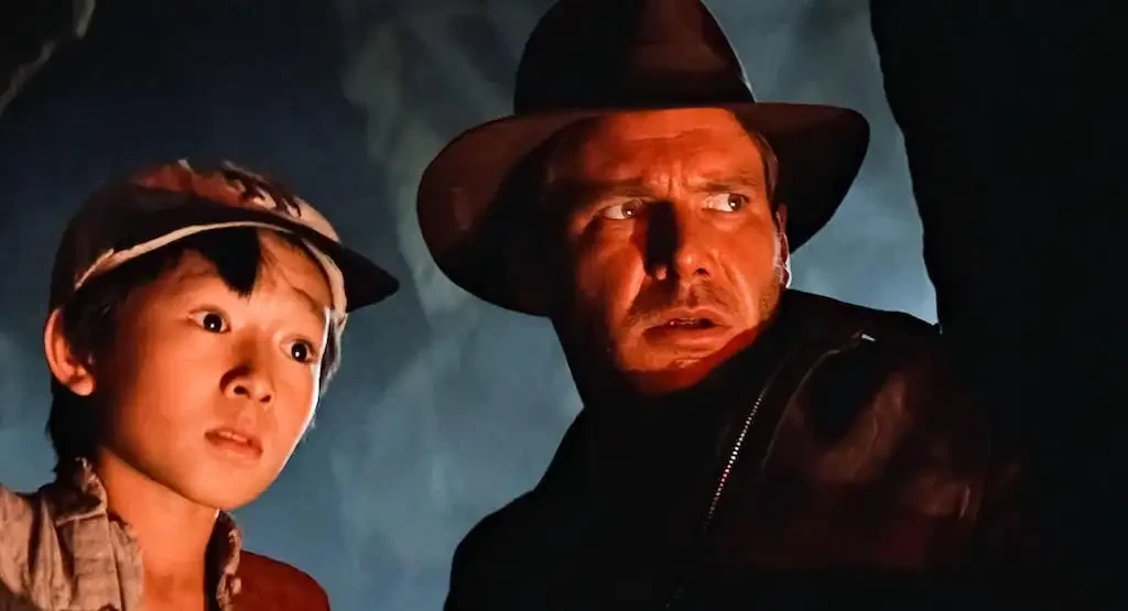 Ke Huy Quan and Harrison Ford in Indiana Jones and the Temple of Doom (1984).