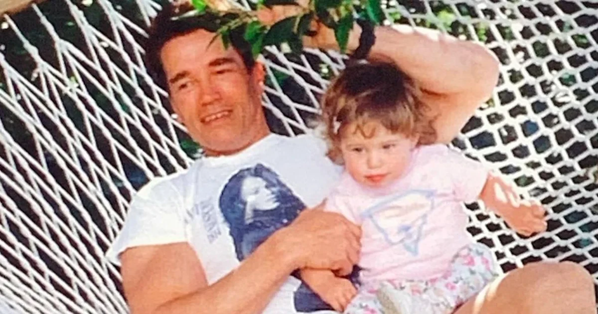 Young Arnold Schwarzenegger with daughter