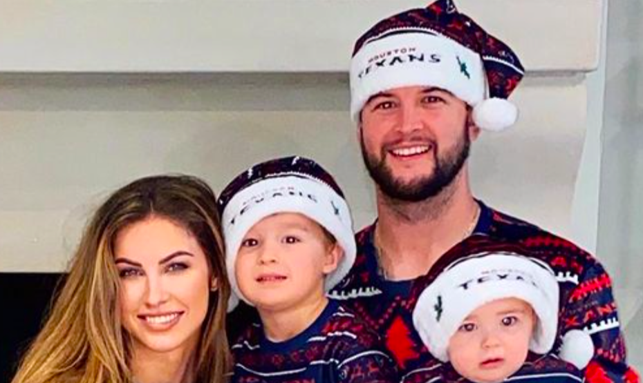 A.J. McCarron and his wife with two of their sons