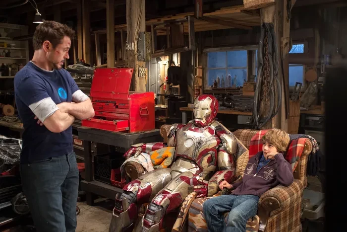 Robert Downey Jr. and Ty Simpkins in Iron Man 3