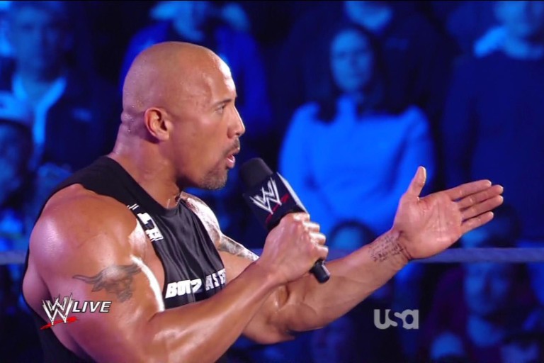 Dwayne Johnson with promo notes written on his left hand.