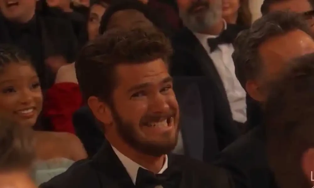 Andrew Garfield grimaces after being called Spider-Man at the Oscars
