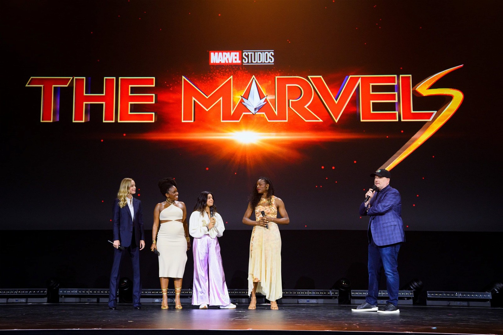 The Marvels trio with director Nia DaCosta and Kevin Feige at D23