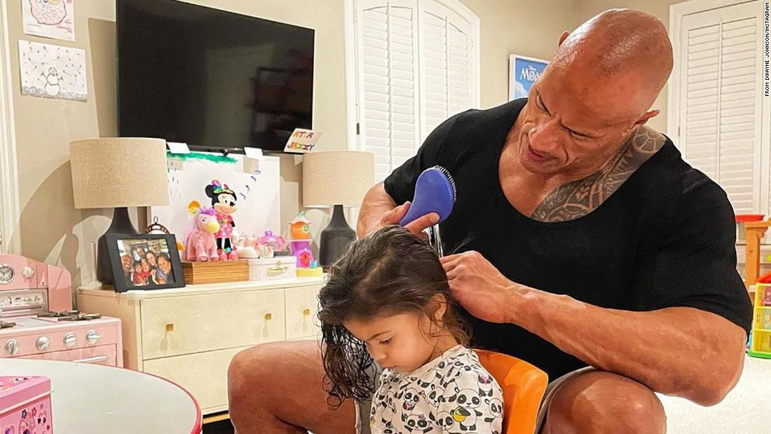 Dwayne Johnson helping her daughter make braids