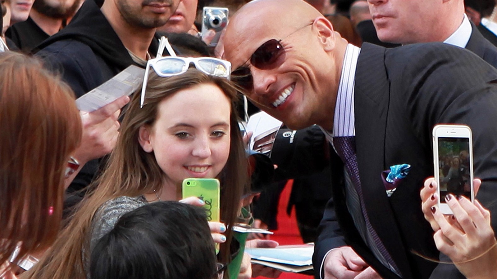 Dwayne Johnson taking selfies for a Guinness World Record