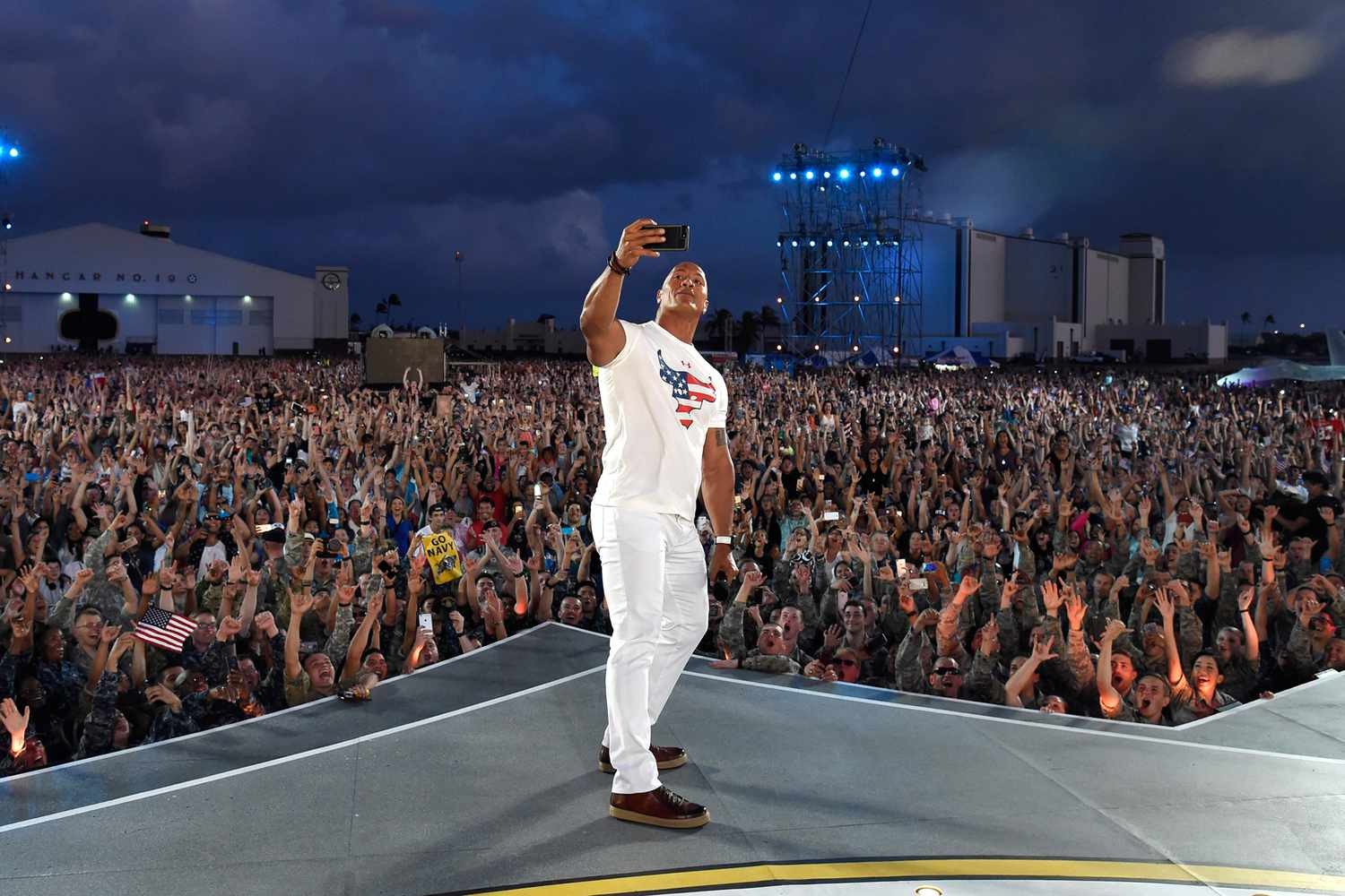 Dwayne Johnson takes a selfie at Rock the Troops