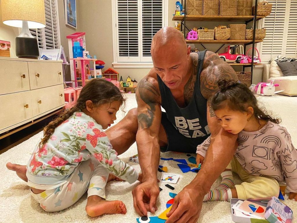 Dwayne Johnson playing with his daughters (Tia Giana Johnson and Jasmine Johnson)