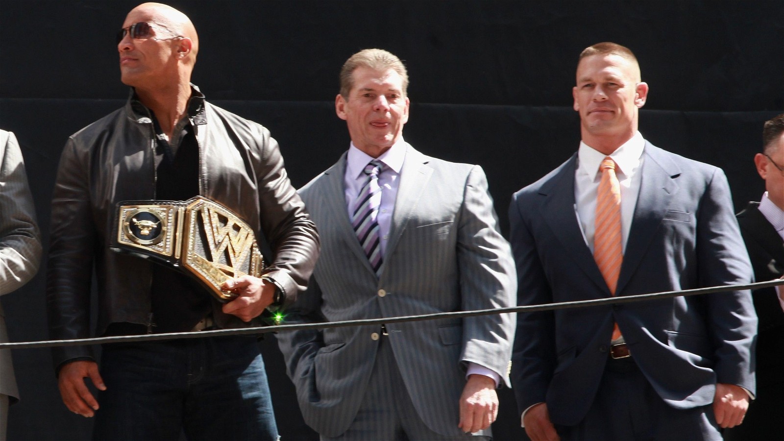 Dwayne Johnson with Vince McMahon and John Cena