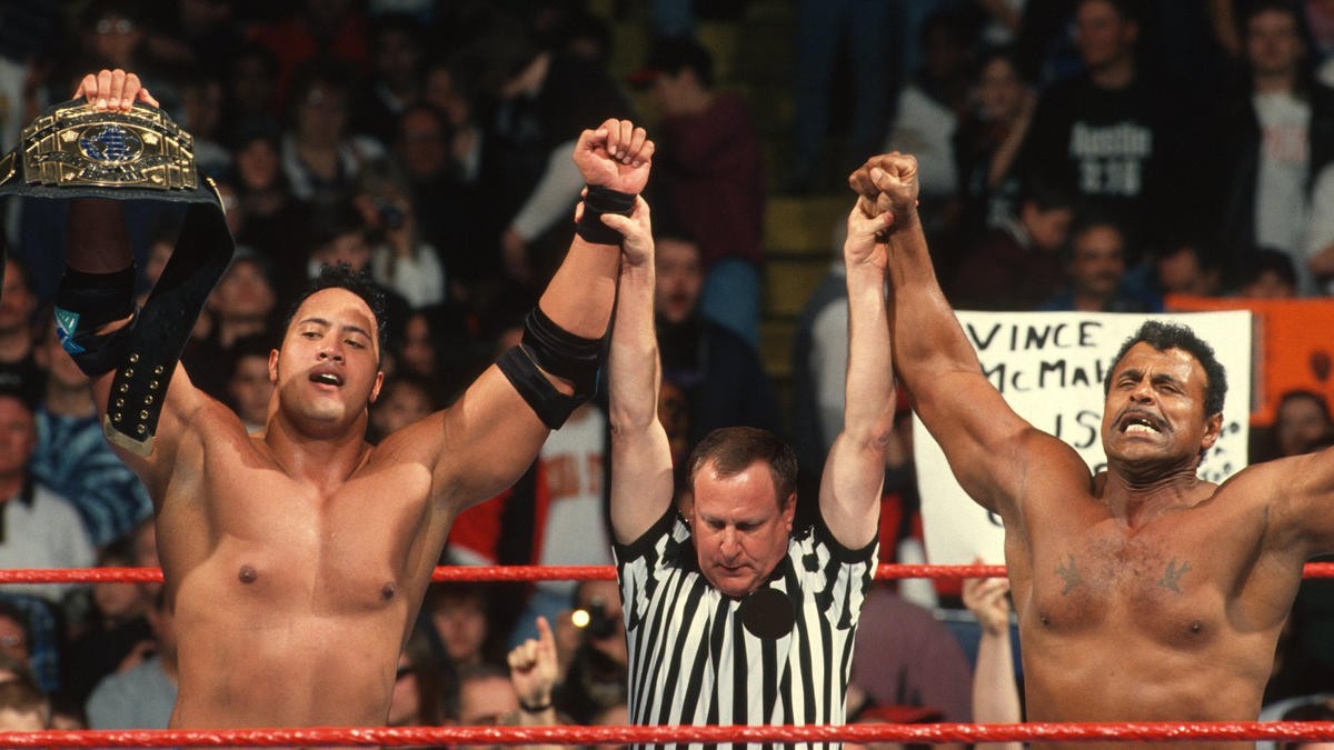 Dwayne Johnson in WWE ring with his father