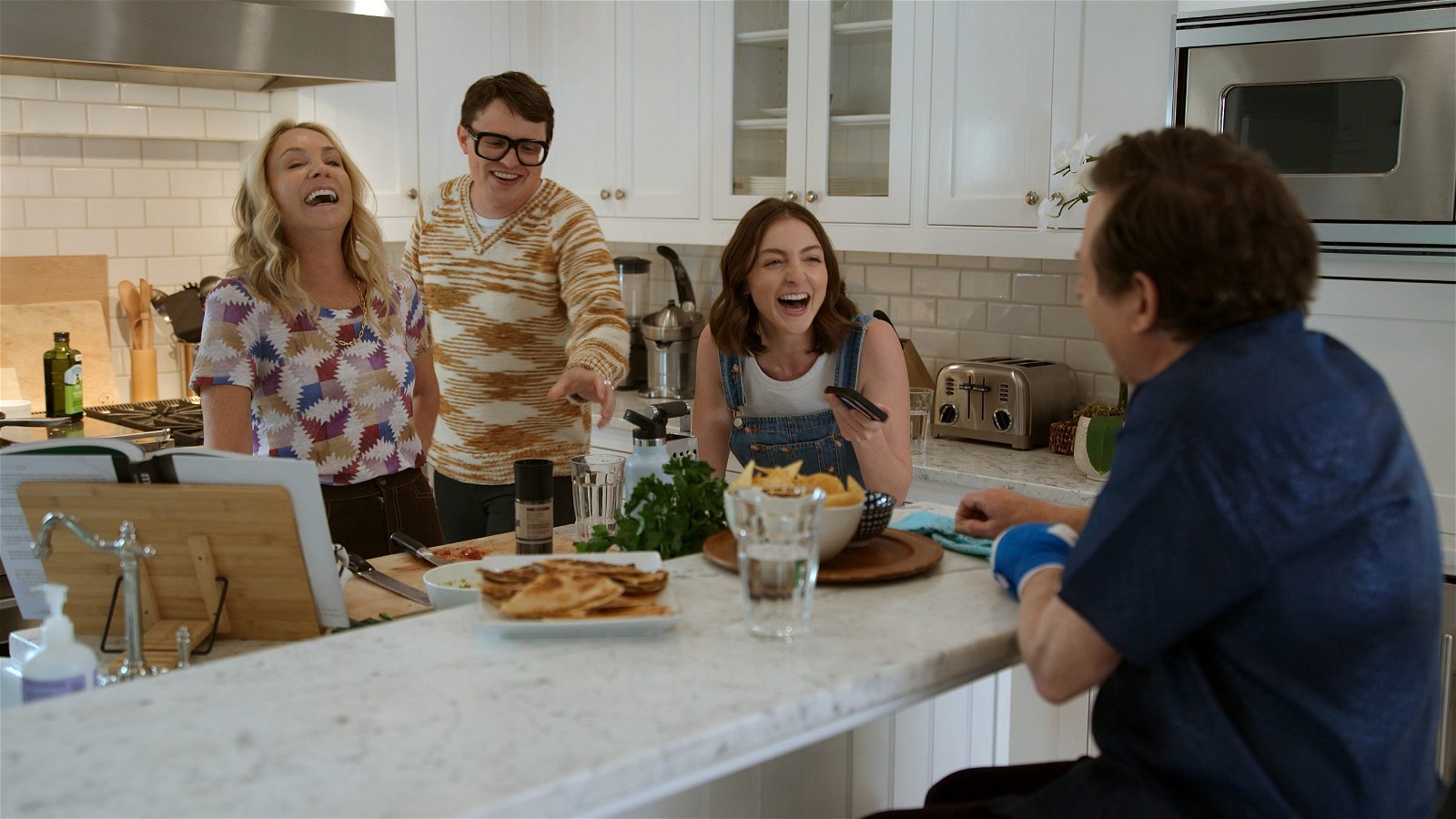 Tracy Pollan, Sam Fox, Esme Fox, and Michael J. Fox in "STILL: A Michael J. Fox Movie," premiering May 12, 2023, on Apple TV+.