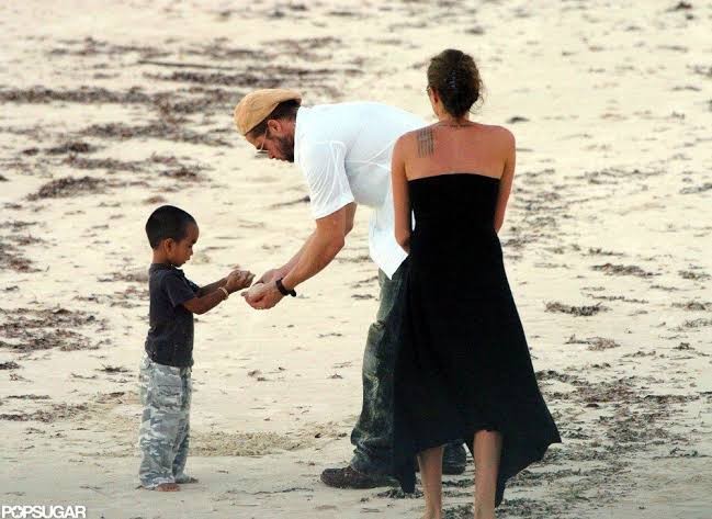 Brad Pitt and Angelina Jolie on a beach in 2005. Pic credits: Popsugar