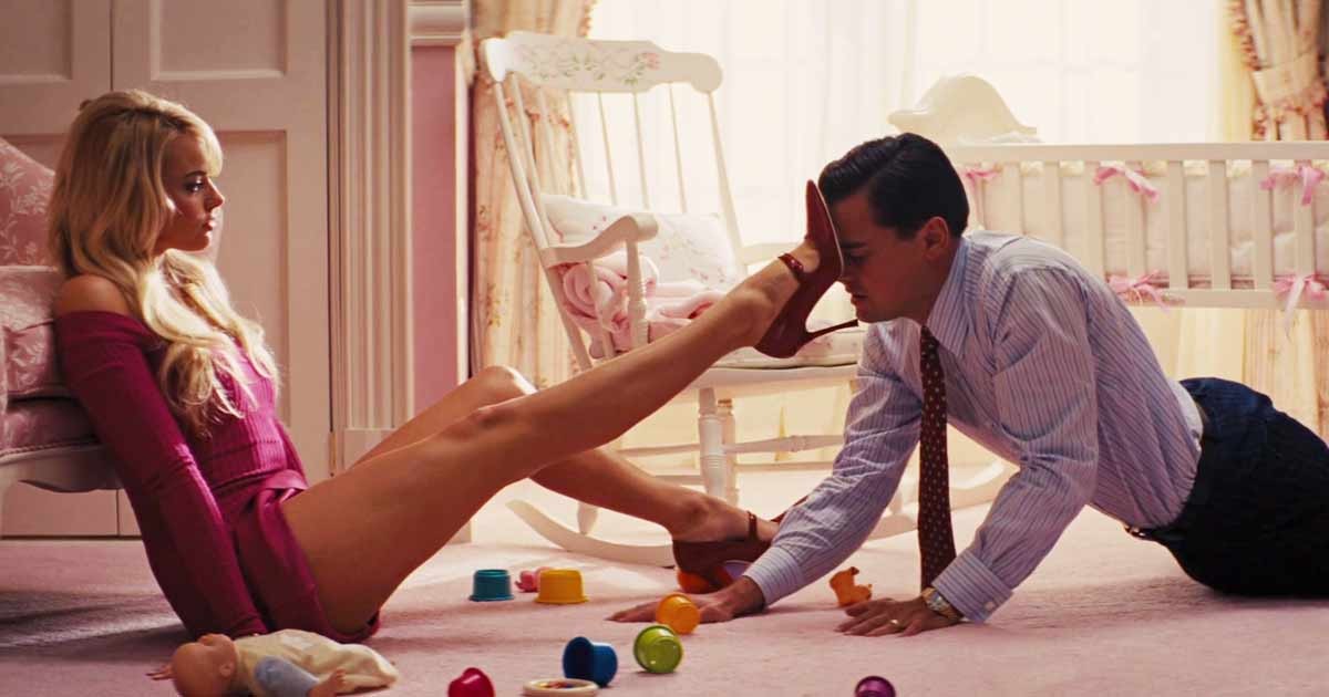 Margot Robbie and Leonardo DiCaprio in the infamous seduction scene from The Wolf Of Wall Street