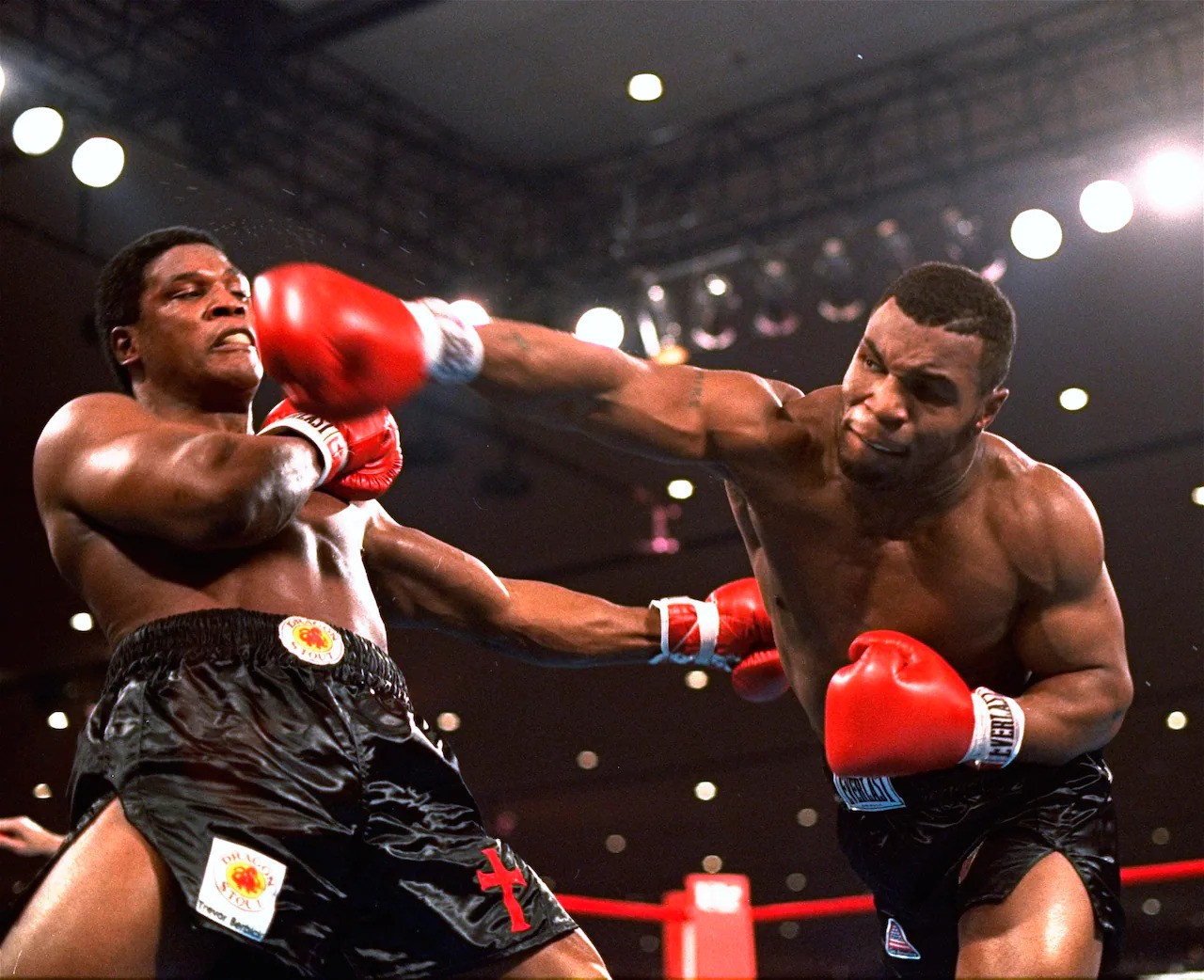 Mike Tyson (R) goes up against Tim Dahlberg (L)