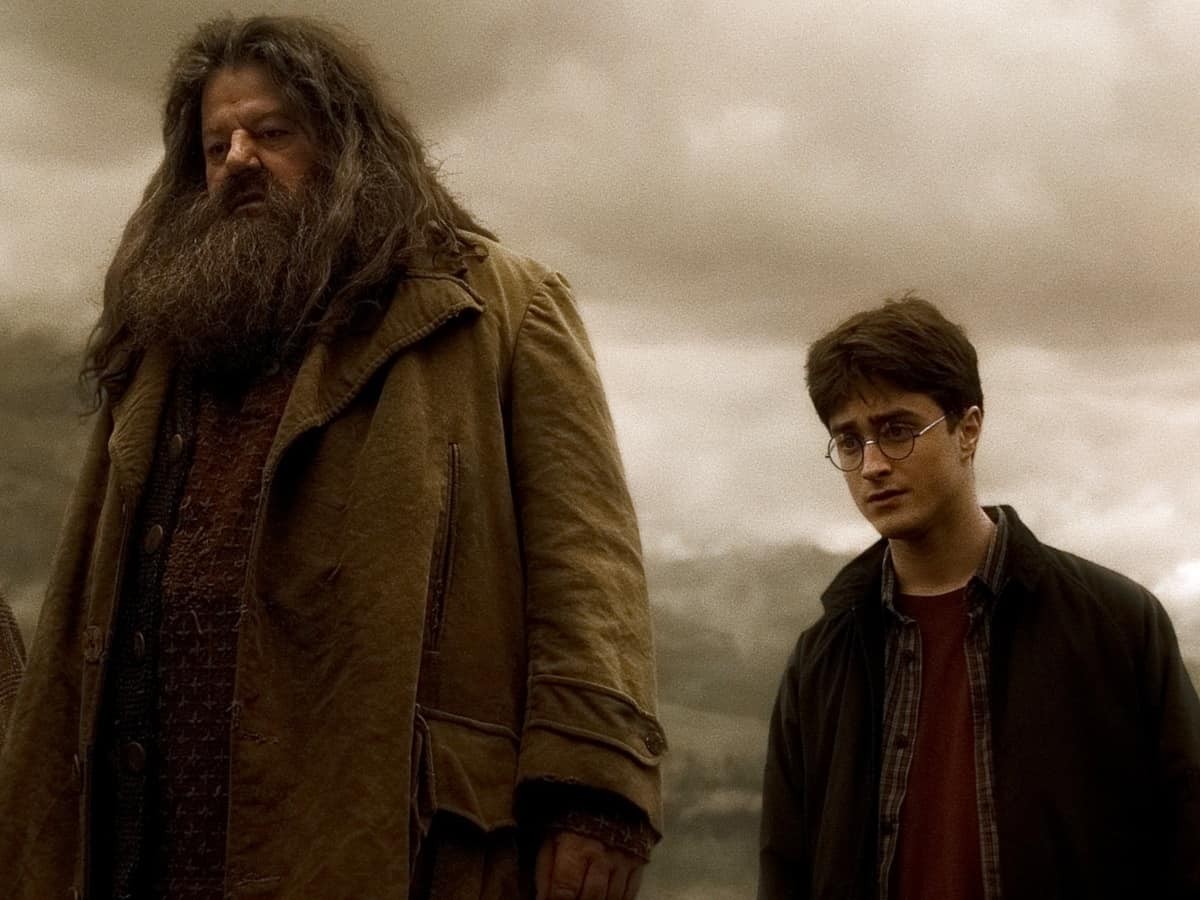 Robbie Coltrane as Hagrid alongside Daniel Radcliffe as Harry Potter.