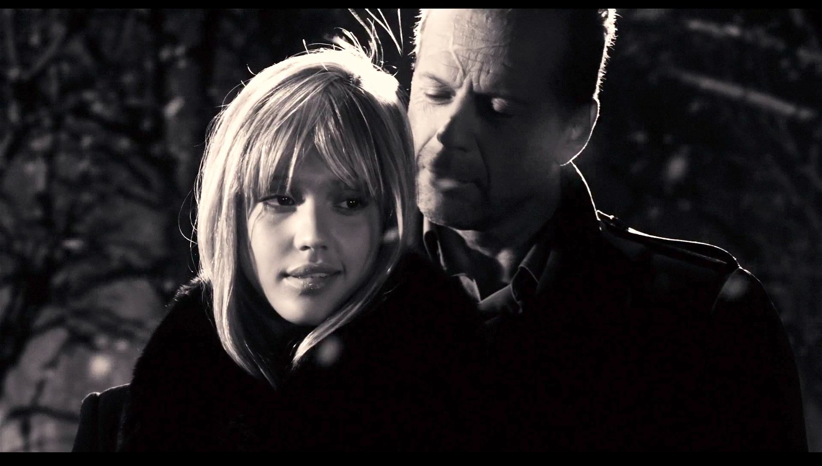 Jessica Alba and Bruce Willis in Sin City (2005).