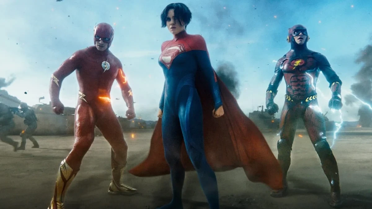 Left to Right: Ezra Miller as Barry Allen/The Flash, Sasha Calle as Kara Zor-El/Supergirl, and Ezra Miller as Young Barry Allen/The Flash in The Flash (2023)