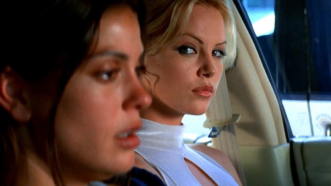 Teri Hatcher and Charlize Theron in the movie