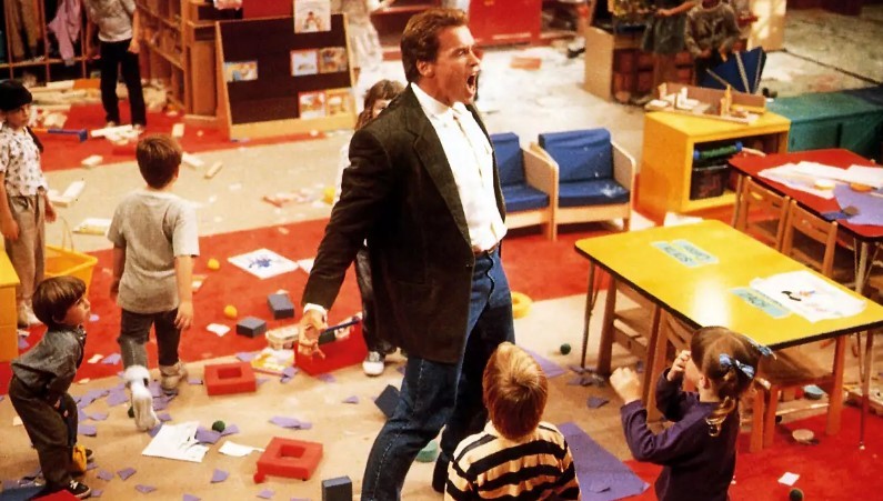 Arnold Schwarzenegger in a still from Kindergarten Cop