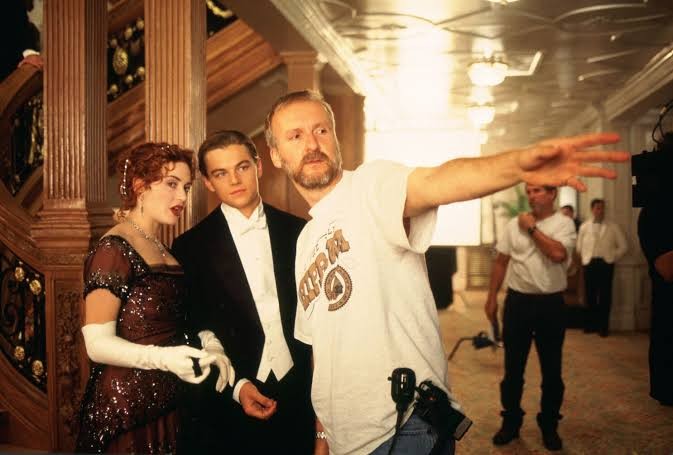 James Cameron directing Kate Winslet and Leonardo DiCaprio on the sets of Titanic