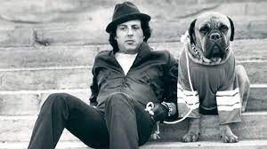 Sylvester Stallone and his dog on the sets of Rocky