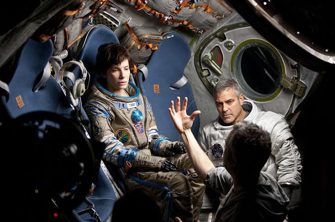 Sandra Bullock and George Clooney behind the scenes of Gravity