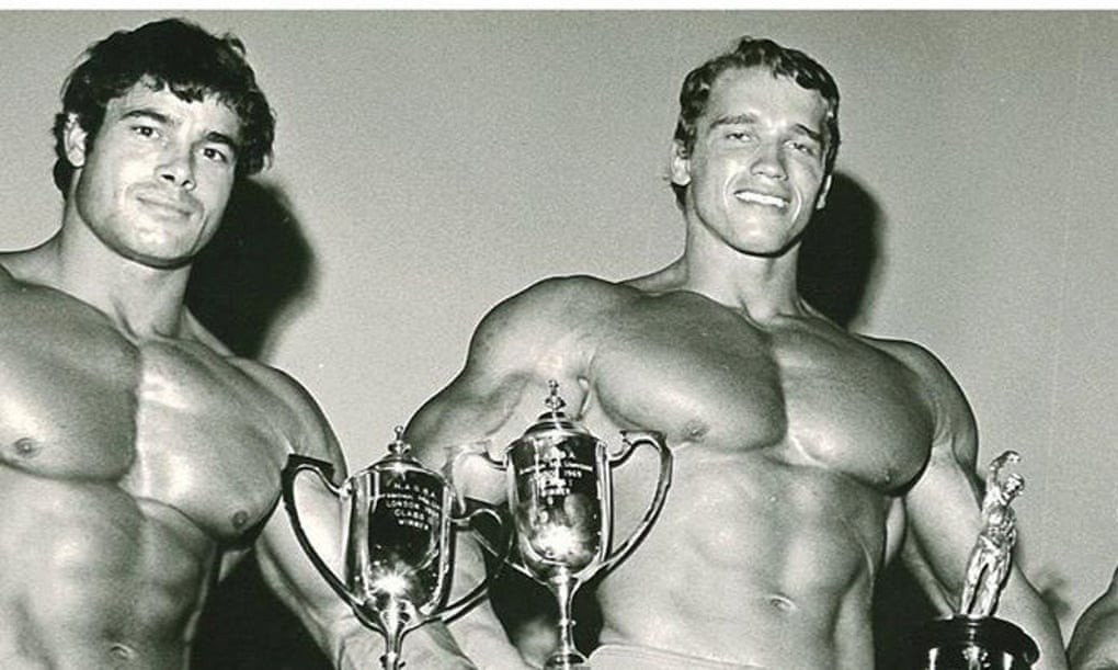 Franco Columbu and Arnold Schwarzenegger on a podium
