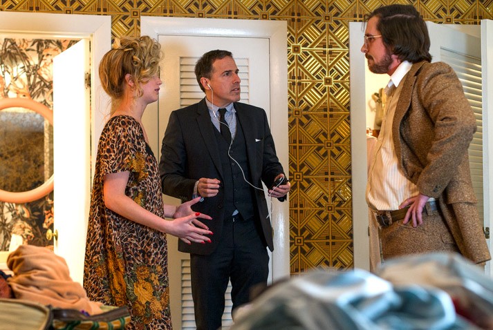 Jennifer Lawrence, David O. Russell and Christian Bale on the set of American Hustle