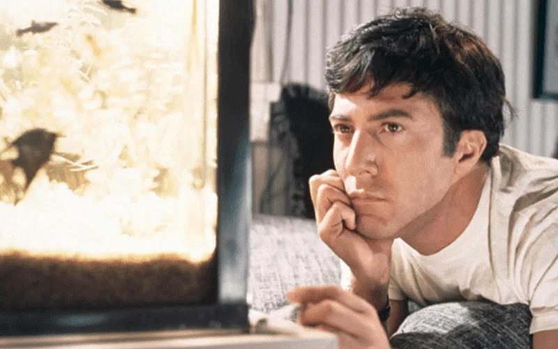 Dustin Hoffman looking lost in thoughts in The Graduate