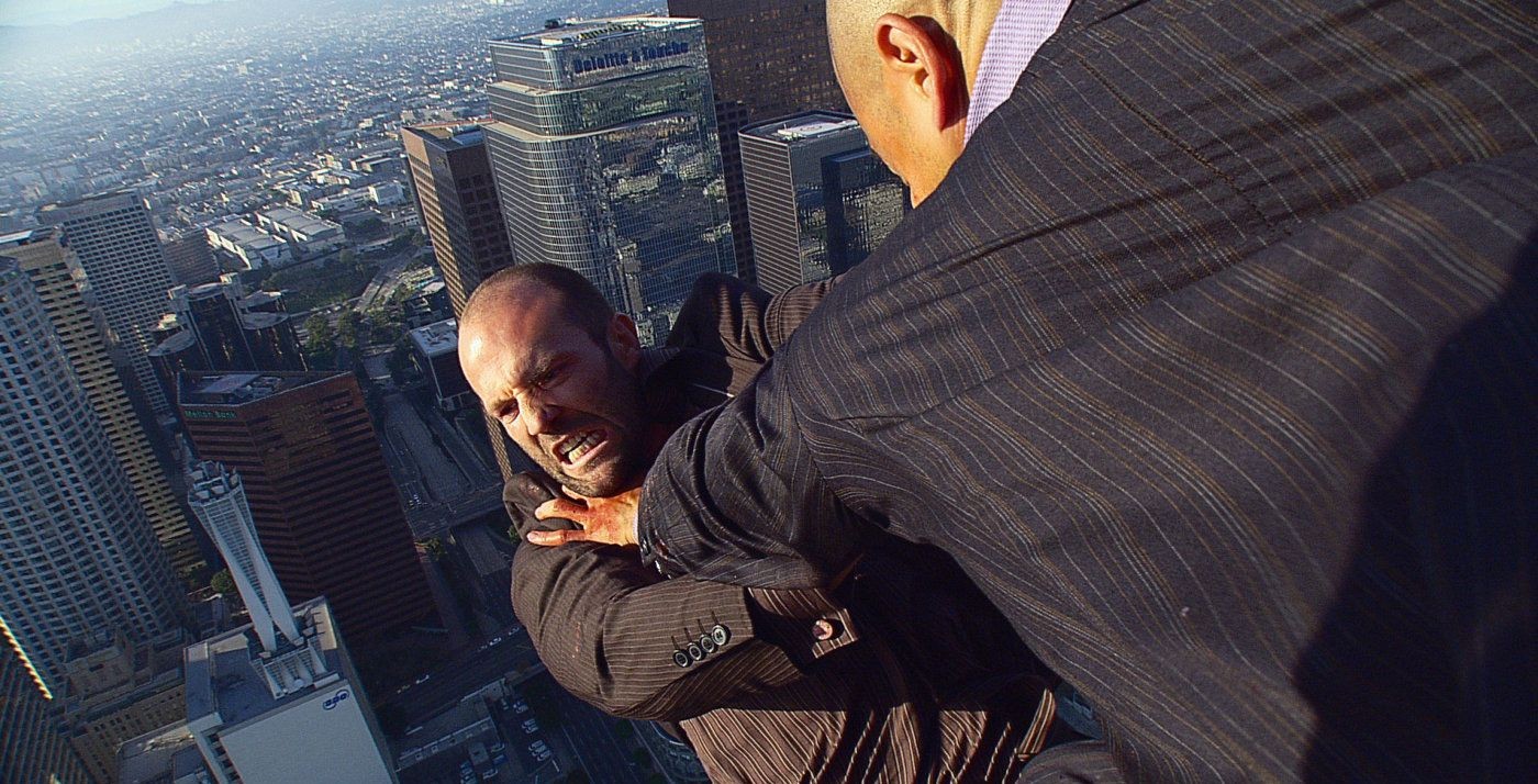 Jason Statham dangling from a helicopter in a still from Crank