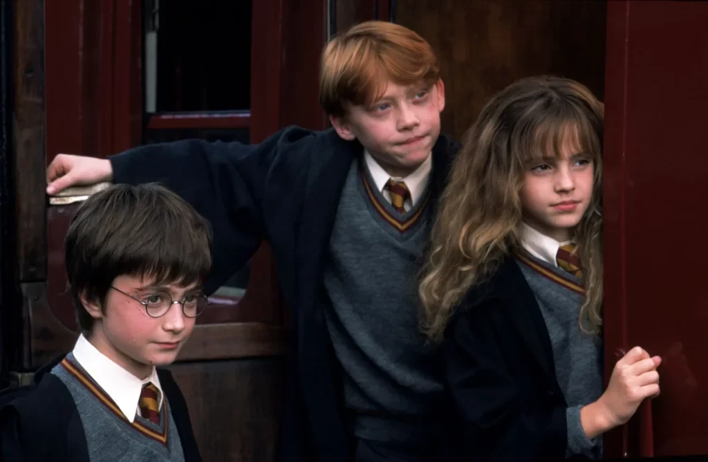 Daniel Radcliffe, Emma Watson and Rupert Grint as the main characters of the Harry Potter franchise