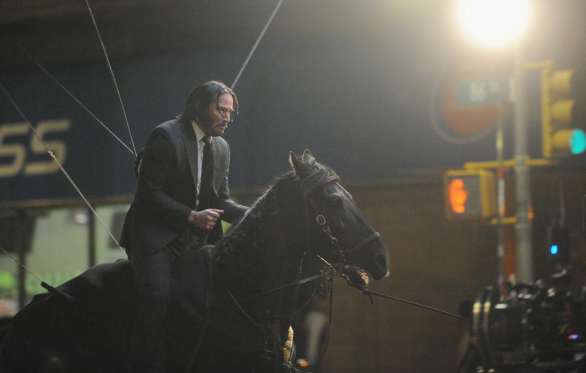 Keanu Reeves performing horse riding action scene in John Wick 3