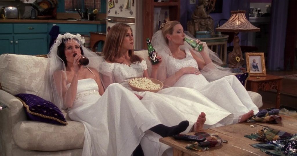 Courtney Cox, Jennifer Aniston, and Lisa Kudrow as Monica, Rachel, and Phoebe in a still from Friends