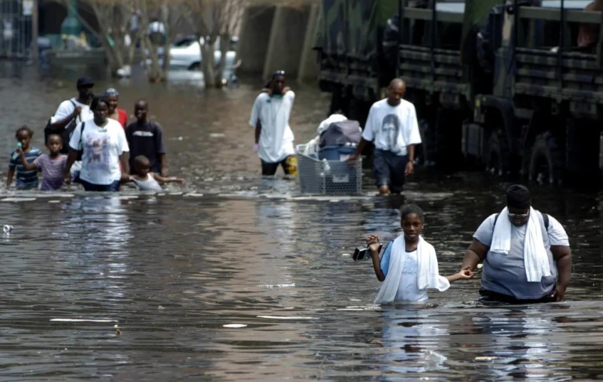 People wade through floodwaters in New Orleans in the aftermath of Hurricane Katrina